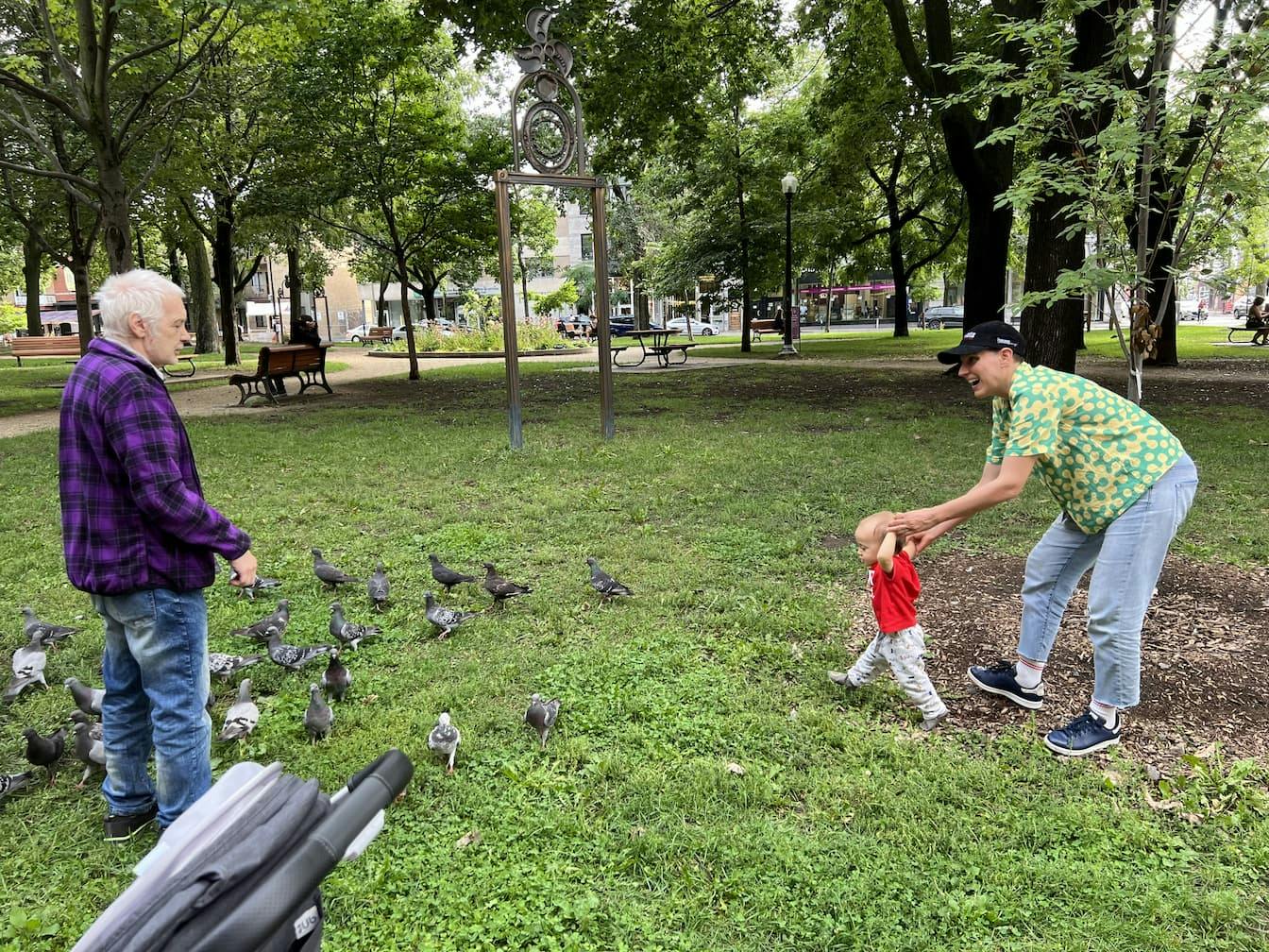 Orlando and Carla taking a walk through Montreal's Parc Lahaie and chatting with a man feeding some birds