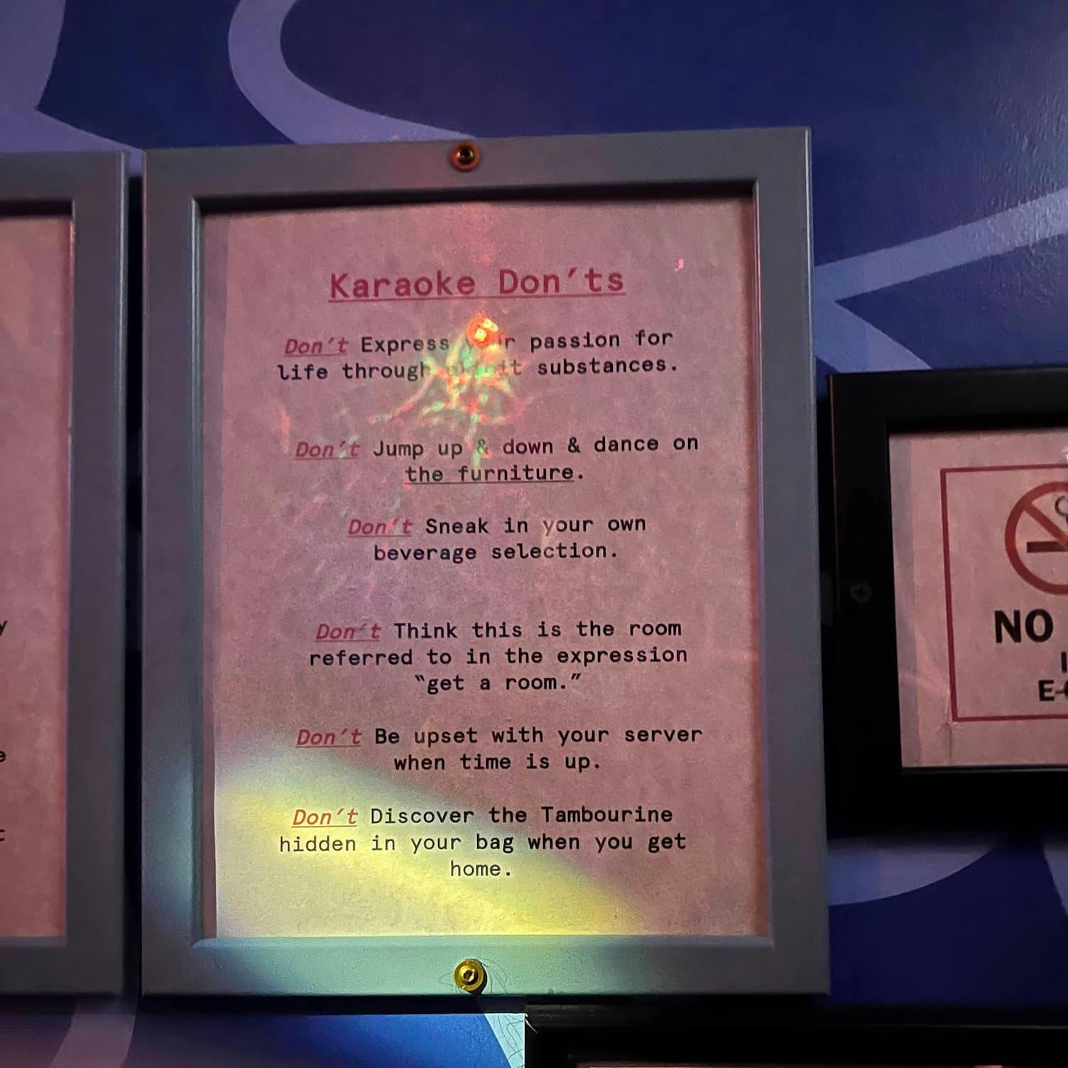 A printed list of karaoke don'ts framed on the wall of Korean BBQ and karaoke spot Insa, in Brooklyn. The last rule reads 'Don't
discover the tambourine hidden in your bag when you get home.'