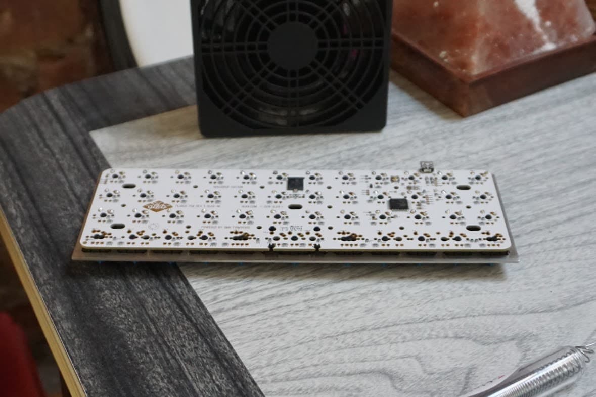 Planck build in progress, with switches mounted to the plate and soldered to the PCB. As this was my first build, I didn't take nearly close enough shots to capture the details, but in this case it's for the best :)